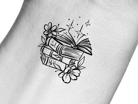 Girly Book Tattoo, Book And Mug Tattoo, Book Tattoo Wrist, Line Art Book Tattoo, Readers Tattoo Ideas, Small Book Tattoos For Women, Small Book Tattoo Ideas, Small Bookish Tattoos, Books And Flowers Tattoo