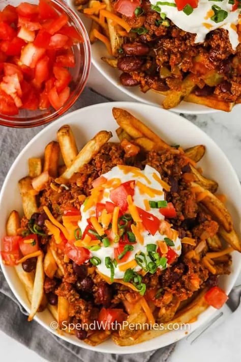 Try making chili cheese fries in the Air Fryer or in the oven for crispy French fry perfection! Nothing beats the taste of loaded fries with melted cheese and all the trimmings. #spendwithpennies #chilicheesefries #recipe #snack #homemade #easy #loaded #oven #best #cheesy Cheese Steak Fries, Steak Fries Recipe, Chili Cheese Fries Recipe, Cheese Fries Recipe, Stovetop Chili, Best Spinach Artichoke Dip, Poutine Recipe, Crispy Oven Fries, Best Chili