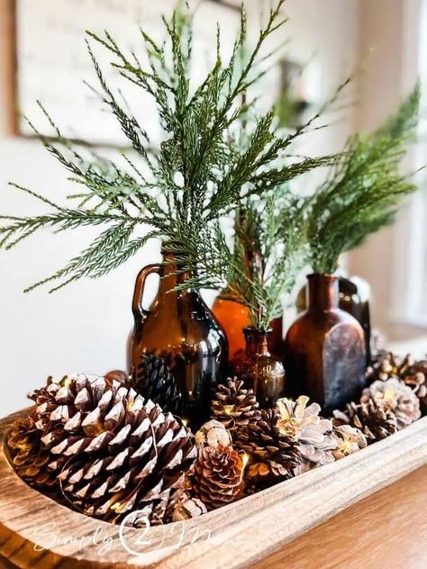 Dining Table Centerpiece Everyday Simple Bohemian, Amber Bottle Christmas Decor, Dining Table Winter Decor, Create Christmas Decorations, Twinkle Lights Christmas Decor, Cabin Winter Decor, Decorating With Bottles, Decorating With Amber Bottles, Winter Island Centerpiece