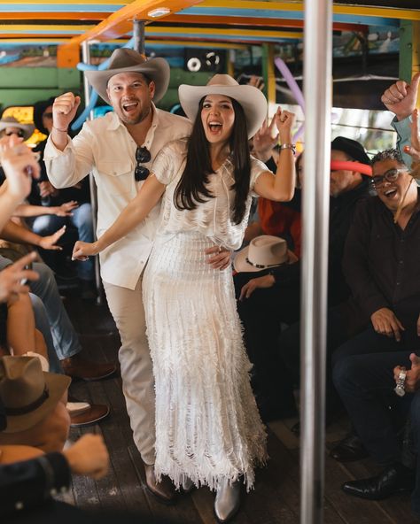 Couple in Chiva Bus | Colombian Wedding Tradition Description: Bride and groom celebrating in a chiva bus, Colombian wedding traditions, pre-wedding celebration, Paisa party in Colombia, destination wedding moments, fun-filled wedding activities 🚍🎶🎉 Colombian Wedding Ideas, Travel Wedding Theme Decoration, Destination Wedding Attire, Colombian Wedding, Scenic Wedding, Exotic Wedding, Honeymoon Planning, Wedding Week, Wedding Traditions