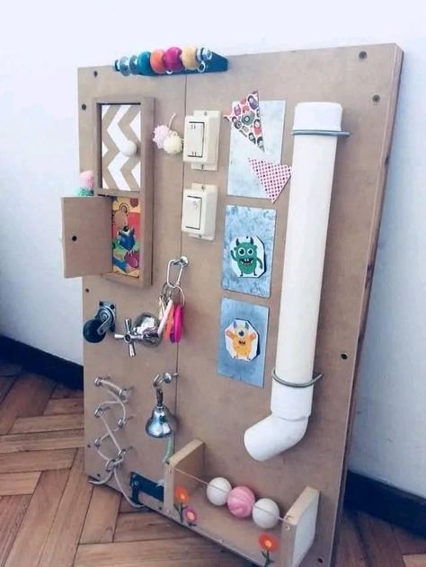 Preschool Busy Board, Diy Baby Sensory Board, Sensory Boards For Toddlers Diy, Busy Wall For Toddlers Diy, How To Make A Busy Board, Busy Boards For Babies, Sensory Boards Diy, Activity Board For Babies, Wall Busy Board