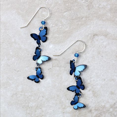 How cute are these delicate Blue Morpho Kaleidoscope butterfly earrings? Each pair is meticulously hand painted, and made with love, which is the best combination, right? • Made and hand-painted in the USA• Sterling silver earring wires Want to see other cute earrings like the Blue Morpho Kaleidoscope Butterfly Earrings? Browse our cute earring category! Kaleidoscope Butterfly, Folded Wings, Butterfly Dangle Earrings, Retro Butterfly, Blue Morpho, Romantic Jewelry, Romantic Jewellery, Girly Accessories, Funky Jewelry