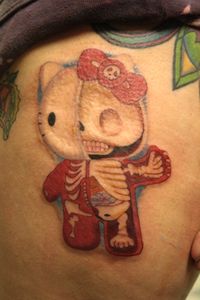 Begging Skeleton Tattoo, Cute Evil Tattoo, Hello Kitty Skeleton Tattoo, Cute Gore Tattoo, Weird Cute Tattoos, Hello Kitty Centipede Tattoo, Skelanimals Tattoo, Domo Tattoo, Vintage Cartoon Tattoo