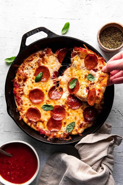 Ditch the pizza stone for this cast iron skillet pizza! There is no outer crust on a skillet pizza so the toppings go from edge to edge, which means extra cheese, extra toppings, extra delicious! Crisp bottom, soft chewy center - think of this like a deep dish pizza but not as deep. Did I forget to mention all you need is 30 minutes? Pizza Cast Iron Skillet, Pizza Cast Iron, Cast Iron Pan Recipes, Iron Skillet Pizza, Pizza Pie Recipe, Making Half A Recipe, Red Pizza Sauce, Cast Iron Skillet Pizza, Cast Iron Pizza