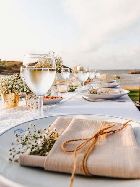 Flowers on Folded Table Napkin · Free Stock Photo Flower With Napkin, Flower In Napkin Table Settings, Flowers On Napkins Place Settings, Minimal Flower Table Setting, Wedding Place Setting Knotted Napkin, Blue Floral Napkins Wedding, Office Potluck, Outdoor Table Settings, Baby S Breath