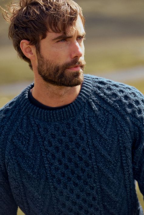 The traditional honeycomb stitch is said to signify luck, abundance and a good catch in the case of a fisherman. You’ve certainly found some treasure when it comes to the Kilronan Aran Mens Honeycomb Sweater. Lovingly crafted and designed in Ireland, this Handknit Merino wool sweater gives the wearer a modern fit with a classic, traditional style. Ethical, sustainable and made with passion. Model Wears: Height: 5ft 10inches Wearing: M Men’s Fisherman Sweater, Chunky Knit Sweater Men, Knit Sweater Man, Men’s Sweater Pattern, Cable Knit Sweater Outfit Men, Knitted Sweaters Outfit Men, Mens Classic Fashion, Knitted Sweaters Men, Honeycomb Sweater