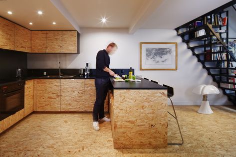 flca architecture renovates parisian apartment using OSB wood and steel Garage Kasten, Osb Furniture, Osb Wood, Attic Kitchen, Oriented Strand Board, Attic Renovation Ideas, Attic Playroom, Small Attic, Attic Bathroom