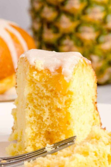 Experience the tropical delight of this cream cheese pineapple pound cake. Quick, easy, and irresistibly moist, this cake uses simple ingredients like your favorite yellow cake mix, cream cheese, and canned pineapple. Perfect for any gathering, its exotic Pineapple Glaze is sure to make your family occasions extra special. Pineapple Cream Cheese Pound Cake Recipe, Pineapple Cake Mix Recipes, Pineapple Orange Cake, Old Fashioned Pineapple Cake Recipe, Pineapple Cream Cheese Pound Cake, Best Pineapple Cake, Pineapple Cream Cheese Frosting, Crushed Pineapple Cake, Cake Mix Cream Cheese