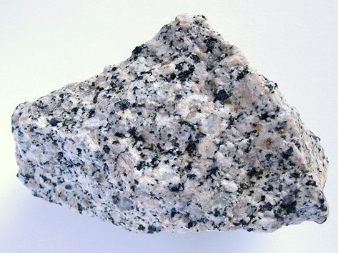 Igneous Rock Types: Granite  Contains quartz, plagioclase feldspar (white), alkali feldspar (beige), biotite (dark mineral) and hornblende (dark mineral)  Light colored coarse grained igneous rock Science Homework, Igneous Rocks, Marble Rock, Rock Hunting, Rock Textures, Rock Types, Metamorphic Rocks, Volcanic Rock, Cool Rocks