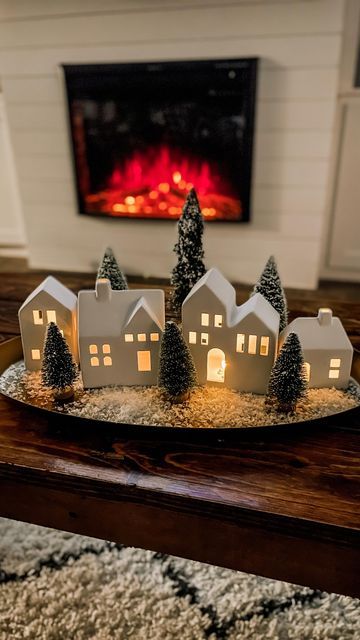 Christmas Alcove Decorations, Christmas Home Decor Fireplace, White House Christmas Village, Christmas Mini Houses Display, Christmas Village Coffee Table, Must Have Christmas Decorations, Rustic Christmas Theme, White Porcelain Christmas Village, Christmas Village Entry Table