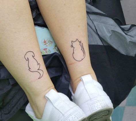 Best Friend Tattoos Cat And Dog, Half Dog Half Cat Tattoo, Cat Dog Matching Tattoo, Couples Dog Tattoos, Matching Dog Tattoos For Couples, Tattoo Ideas Animal Lover, Matching Cat And Dog Tattoos, Cat And Dog Paw Tattoo, Dog Cat Tattoo Simple