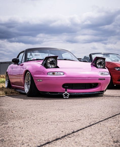 — via that.96miata || pink car, miata, jdm, mx5, mazda, aesthetic, sports car, car girl, expensive, interior, decor, mods, modification, pretty car, 90s, tsurikawa, japanese car, pop up headlights Pink Car Modifications, Pink Miata Mx5, Miata Headlights, Mazda Miata Aesthetic, Pink Mazda Miata, Mazda Miata Mx5 1990, Mazda Aesthetic, Cute Miata, Pink Mazda