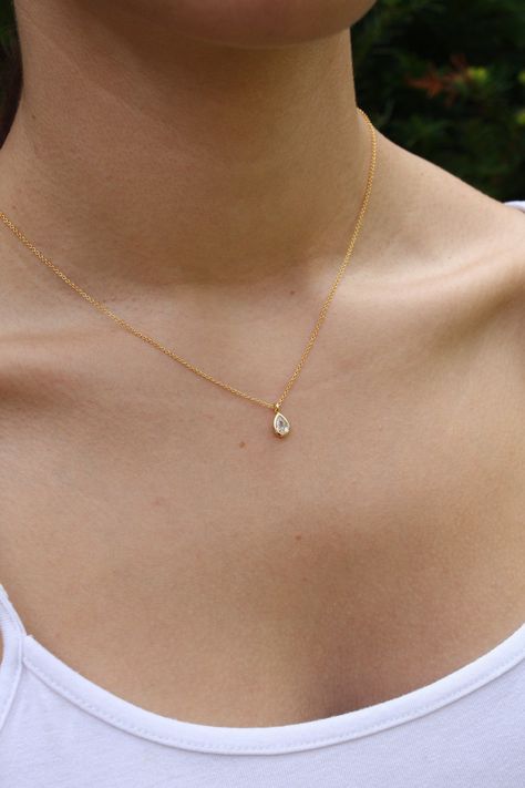 Tiny Drop Minimalist Necklace, Dainty Crystal Quartz Teardrop Pendant, Layering Everyday Jewelry, April's Birthstone, Gift for her, Silver This dainty and delicate layering necklace features a tiny clear crystal quartz teardrop bezel framed in your choice of gold filled or sterling silver. The petite pendant is suspended from a dainty chain in the finish of your choice. ...#Minimalist #of #Elegance #Jewelry #Jewelry #Embracing #Organizers #Art #Beauty #The #and #of #the #Exploring #Simplicity Everyday Gold Necklace Minimalist Jewelry, Small Dainty Necklaces, Pretty Dainty Necklaces, Simple Formal Jewelry, Dainty Jewelry Silver Necklace, Dainty Bridesmaid Jewelry, Simple Beautiful Necklaces, Simple Dainty Necklace, Minimalist Gold Pendant