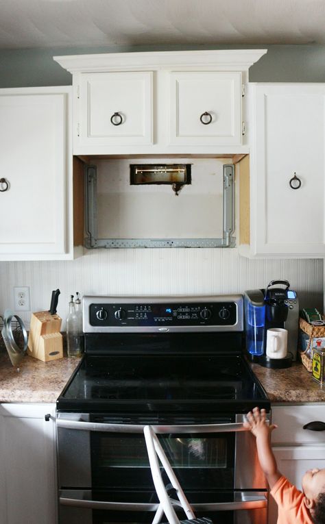 Made by Carli: My DIY Kitchen: How I Built a Rangehood Over an Existing Cabinet Hood Vent With Cabinets Above, Over Oven Vent, Replace Range Hood, Cabinet Over Microwave Ideas, Remove Microwave Above Stove Add Hood, Replace Over Range Microwave With Hood, Removing Microwave Above Stove, Diy Microwave Shelf, Hiding Microwave In Kitchen