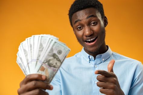 Excited black guy holding stack of dolla... | Premium Photo #Freepik #photo #man-with-money #happy-money #holding-money #people-money Hulk Memes, Yellow Studio, Holding Money, Black Guy, Christian Love, Man Down, Waiting For Him, Money Cash, Happy Women