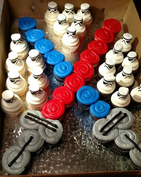 Light Saber Cupcake Cake | Star Wars Party Ideas Star Wars Birthday Cake Easy, Starwars Birthday Cake Ideas, Cupcake Ideas For Men, Clone Wars Cake, Starwars Party Ideas, Star Wars Birthday Cake Ideas, Easy Star Wars Cake, Star Wars Cake Easy, Star Wars Desserts