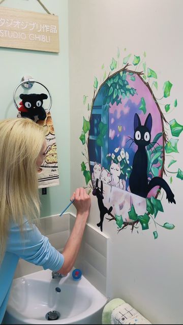 Jamie Jo Art on Instagram: "Kiki’s Delivery Service is my fav 😍 Thought this might be an interesting video to let you know that I do clean dust from my paintings 🎨🧼🫧 and do paint touch ups on the murals in more high traffic areas 😅 I like using lent rollers for the dust, and I don’t have clean too often, but it definitely makes them feel fresh and nice again!  #studioghibli #art #painting #wallmural #homeideas #homedesign #kiki #jiji #kikisdeliveryservice #anime #animemovie #paint #acrylic #animeart #wallart #bathroomdesign #interiordesign" Anime Wall Murals Painted, Kiki's Delivery Service Sign, Studio Ghibli Mural, Anime Mural, Places Reference, Ghibli Crafts, Studio Ghibli Crafts, Cartoon Friends, Kid Room Ideas