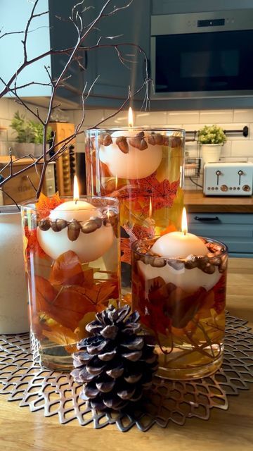 Jennifer S Reynolds on Instagram: "Floating Autumn candle Display 🍁🍂 Hi lovelies , I thought you might like to try this 😊 All you need is : * 3 Glass vases / From tall to small * Artificial Autumn foliage / Garland cut sizes to fit your vases . * Acorns picked or bought. I picked mine from the garden and spray painted them a copper colour *Couple of jugs of water fill as desired amount * Floating candles you can find them online Amazon & Temu or even in your local home decor store. That’s it Foliage Garland, Candle Display, Autumn Candle, Autumn Foliage, Italian Home, Candle Displays, Floating Candles, Autumn Decor, Country House Decor