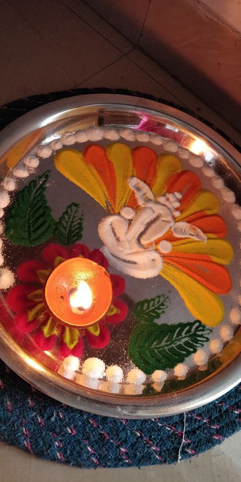 try this thali wali rangoli, its portable and let you clean the place as well Rangoli Thali Decoration, Diy Hair Diffuser, Diwali Toran, Arti Thali Decoration, Arti Thali, Aarti Thali, Diwali Wallpaper, Thali Decoration, Pooja Decoration