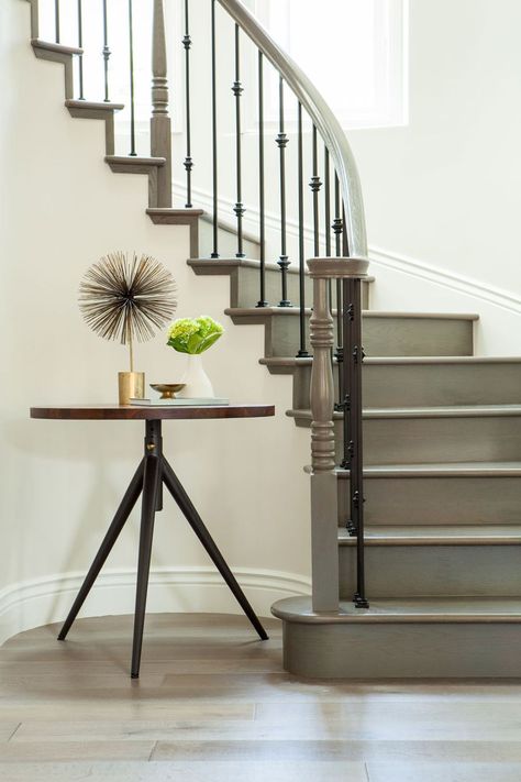 Green grey painted stairs makes for a detail-conscious look. Grey Painted Stairs, Painted Staircases, Staircase Makeover, Wood Staircase, Stairway Design, Stair Case, Painted Stairs, Curved Staircase, Hamptons House