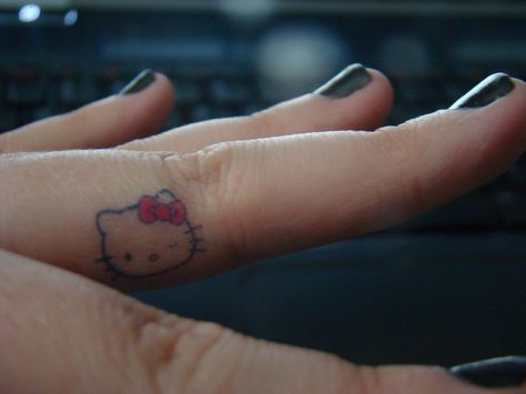 Hello Kitty Finger Tattoo  ErinSiobhann Hello Kitty Tattoo Finger, Hello Kitty Ankle Tattoo, Y2k Finger Tattoo, Hello Kitty Finger Tattoo, Kitty Finger Tattoo, Tattoo Hello Kitty, Middle Finger Wallpaper, Kitty Tattoos, Matching Tats