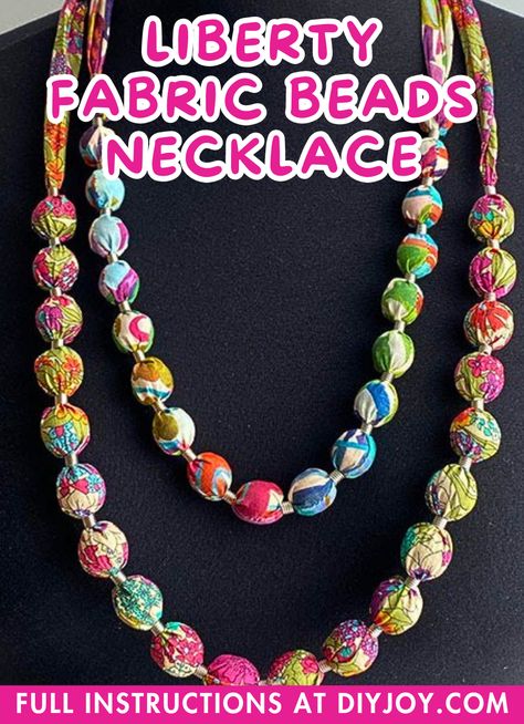 Liberty Fabric Beads Necklace DIY via @diyjoycrafts How To Make Fabric Necklace Ideas, Diy Fabric Beads Tutorial, Fabric Bead Necklace, Fabric Covered Beads, Fabric Scrap Jewelry Diy, Fabric Beads Necklace, Fabric Necklace Diy Handmade, Fabric Beads Tutorial, Fabric Necklaces Ideas