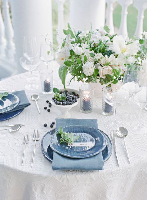 Blueberries were dotted throughout many of the wedding's elements. "They're high-impact and budget-friendly, and the color was perfect for the location," says planner Rebecca Stone. Denim-blue plates atop quilted white-cotton linens lent a relaxed feel to the sweetheart table. Knotted Napkin, Wedding Reception Napkins, Charleston Wedding Venues, Martha Weddings, Wedding Elements, Napkin Folding, Martha Stewart Weddings, Nautical Wedding, Wedding Table Settings