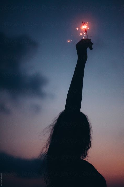 Silhouette Of A Young Woman Holding Up High A Sparkler At Night | Stocksy United New Year Poses Picture Ideas, New Year Photoshoot, Sparkler Photography, Fireworks Photo, Fireworks Photography, Diwali Pictures, Blue Woman, Birthday Background Images, Self Photography