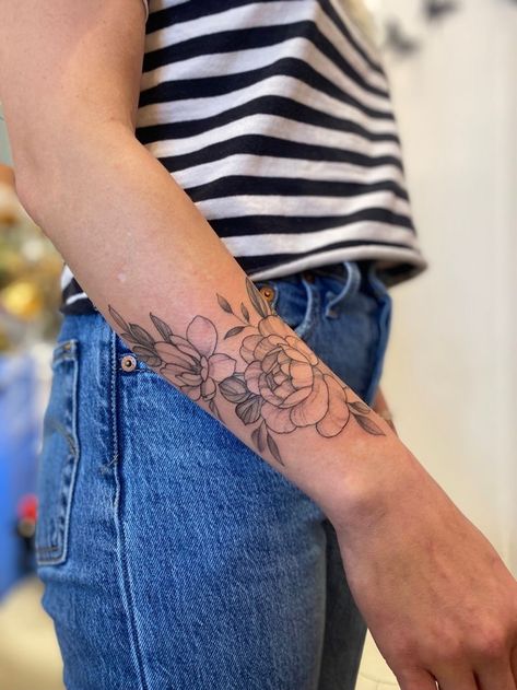 Wrist Half Sleeve Tattoos, Top Of Wrist Flower Tattoo, Magnolia Tattoo Wrist, Peonies Tattoo Wrist, Peony Tattoo On Forearm, Small Peony Wrist Tattoo, Forearm Peony Tattoo, Peony Wrap Around Tattoo, Peony Forearm Tattoo Women