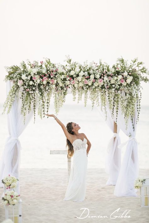 Perfect beach wedding arch. Romantic, flowing, gorgeous, white and light pink. Spray roses, hydrangea, small leaf eucalyptus, delphinium, garden roses Delphinium Garden, Beach Wedding Arbors, Destination Wedding Aruba, White Orchids Wedding, Pink Spray Roses, Beach Wedding Arch, Wedding Arbors, White And Pink Roses, Wedding Arbour