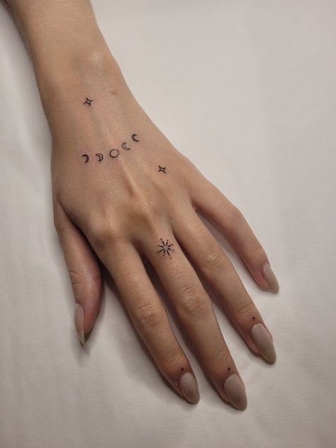 #tattoo, #tattoos, #inked, #tattooart, #tattooedwomen, #tattooedguys, #tattooinspiration, #tattooideas, #tattooworldwide, #tattoosociety, #InkLaughs, and #TattooFails​ Moon Finger Tattoo Designs, Sun Moon Star Hand Tattoo, Celestial Finger Tattoos For Women, Star Tattoos Hand, Minimalist Hand Tattoos For Women, Ataraxia Tattoo, Hand Tattoo Minimalist, Left Hand Tattoo, Small Finger Tattoos