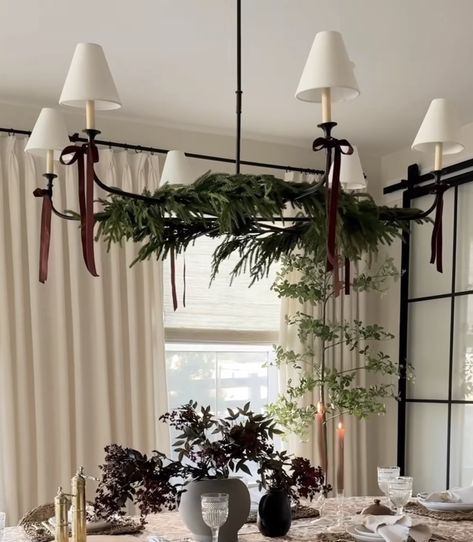 Christmas Decor Victorian House, Christmas Greenery On Chandelier, Christmas Decoration For Dining Table, Christmas Bows On Chandelier, Organic Modern Christmas Mantle, Bows On Light Fixtures Christmas, Christmas Decorations On Chandelier, Timeless Dining Room Decor, Bows On Chandelier