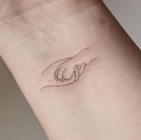 Small Tattoo Ideas For Dog Lovers, Animal Welfare Tattoo, Hand Holding Paw Tattoo, Fine Line Labrador Tattoo, Paw In Hand Tattoo, Dog Tattoo Fine Line, Meaningful Dog Tattoos, Paris Tattoo Ideas, Vet Tech Tattoo