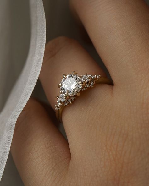 The glowing face of a full moon floating upon diamond clouds🌕 A closer look at the Bespoke Daphne Ring that got so much love last month: with her modified pear cut diamond side stones and removed shoulder stones to create a one-of-a-kind new silhouette✨ Discover customization options just like this bespoke engagement ring through our online Bespoke Inquiry page! Our 2024 Bespoke Cut-off is approaching quickly, make sure to get your inquiry in by October 6th for holiday delivery🎁 Secret Garden Engagement Ring, Laurie Fleming Daphne Ring, Refined Lab-grown Diamond Wedding Ring With Brilliant Cut, Lab-grown Diamond Ring With Brilliant Cut For Wedding, Lab-grown Diamond Ring With Center Stone, Lab-grown Diamond Ring With Center Stone For Proposal, Laurie Fleming, Glowing Face, Garden Engagement