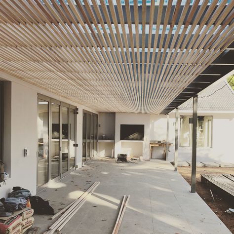 Minc Design Studio on Instagram: “Back patio pergola with slatted timber ceiling. Site looking good so far #mincdesignstudio #renovation #interiorarchitecture” Timber Patio Roof, Slatted Roof Pergola, Wood Slat Ceiling Outdoor, Slat Roof Pergola, Pergola With Slats, Timber Slat Ceiling, Covered Outdoor Space, Wooden Pergola Designs, Back Patio Pergola