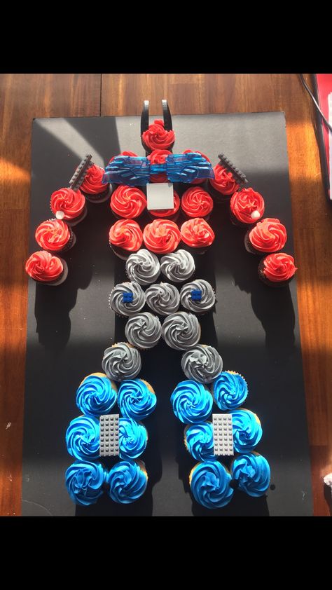 Optimus Prime Cupcakes Transformers birthday Transformers Birthday Cake Ideas, Transformers Food Ideas, Transformers Birthday Cupcake Cake, Trans4mer Birthday Ideas, Transformers Birthday Cake Diy, Cheap Birthday Food Ideas, Transformers Theme Party, Optimus Prime Cupcakes, Transformers Themed Food