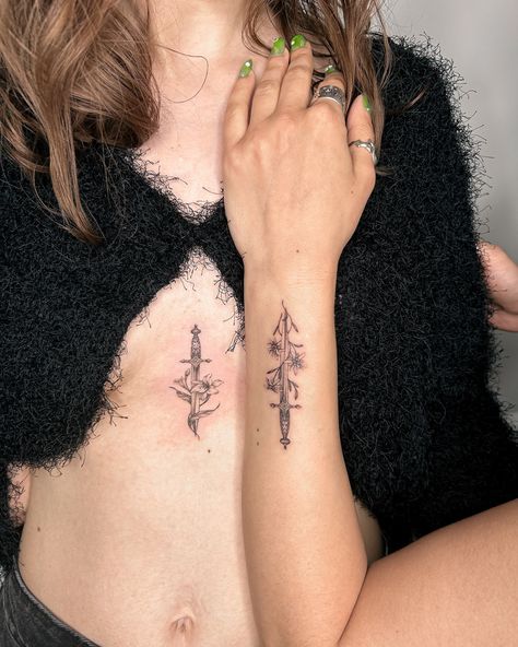 Hope everyone had a good long weekend 🍁I’m still catching up on posting so here are some matching sword/dagger tattoos for two lovely sisters we did a while ago 👯‍♀️ each one has each other’s favourite flower wrapping around the sword🗡️ such a fun session working with you both 🤍 Two Swords Crossed Tattoo, Dagger Flower Tattoo, Tattoos For Two, Dagger Tattoos, Matching Tattoos For Couples, Flower Wrapping, Dagger Tattoo, Sides For Ribs, Side Tattoos