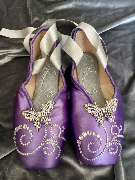 Decorated Pointe Shoes. Created in 2018 for a Nutcracker dancer performing the role of Oriental Lead (Chinese lead). Colors and design were inspired my her costume. Painted, embellished. Purple Pointe Shoes, Pointe Shoes Decorated, Painted Pointe Shoes, Decorated Pointe Shoes, Colored Pointe Shoes, Purple Ballet Shoes, Ballet Pointe Shoes, Dance Lover, Shoe Crafts