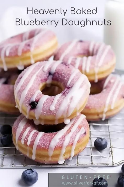 Heavenly Baked Blueberry Doughnuts (Gluten-Free)" are an absolute delight for those with a sweet tooth. These doughnuts combine the fresh sweetness of blueberries with a melt-in-your-mouth tender doughnut base. The smooth vanilla glaze adds a finishing touch of sweetness, creating a treat that's perfectly balanced, not overly sugary. Enjoy these delightful gluten-free treats anytime, guilt-free. Gluten Free Donut Recipe, Blueberry Doughnuts, Baked Doughnut Recipes, Gluten Free Doughnuts, Blueberry Donuts, Gluten Free Donuts, Vanilla Glaze, Homemade Gluten Free, Doughnut Recipe