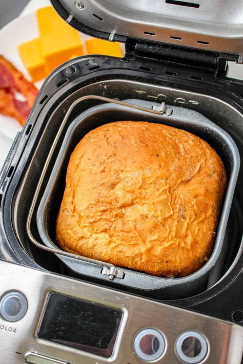 This easy-to-make bread machine cheese bread recipe is made with cheddar cheese and crisp bacon swirls in the dough before baking. Bread maker recipes take all the work out of making fresh baked bread, and this cheddar bacon bread version is no exception. Perfect for soup, sandwiches, and toasting! Bread Machine Recipes Bacon And Cheese, Bread Machine Recipes Fall, Bread Maker Breakfast Bread, Bread Maker Sweet Bread, Bread Machine Recipes Cheese, Cheese Buns Bread Machine, Bread Recipes In Bread Machine, Bread Machine Garlic Cheese Bread, Starfrit Bread Maker Recipes