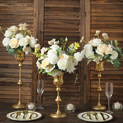 PRICES MAY VARY. Quantity: 3 Flower Vase Centerpieces (Assorted Sizes) Material: Metal Color: Metallic Gold Style: Vintage Style Trumpet Flute Vase Small Vase Height: 12.5" Medium Vase Height: 15.5" Large Vase Height: 18.5" Top Diameter: 5" Base Diameter: 4.75" Depth: 4.25" Pole Diameter: 10mm Assembly Required: Yes. Easy to Assemble. Perfect for both flowers and candles or as a great wedding table centerpiece. HIGH QUALITY: These candle holders are made from high-quality premium material. To ma Trendy Vases, Flute Table, Gold Vase Centerpieces, Everyday Table Decor, Trumpet Flower, Tall Wedding Centerpieces, Gold Centerpieces, Fluted Vase, Decorative Stand