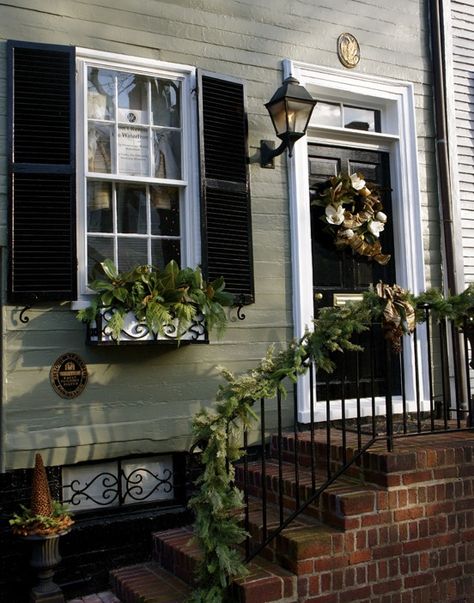 Shutter color for a green house Sage Green House Exterior, Sage Green House, Farmhouse Colors, Green House Exterior, Brick Porch, Black Front Door, Best Exterior Paint, Black Shutters, Christmas House Lights