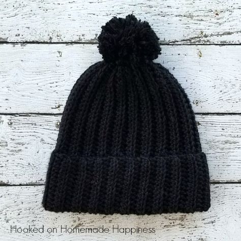 This black beanie has a classic design, but is made a little differently than your typical crocheted hat. It’s worked as a rectangle and then sewn into a hat. There’s a little bit of ribbing to add some subtle texture and the double brim will help keep ears extra warm. This pattern is available as … Black Beanie Crochet, Black Crochet Hat, Crochet Patterns Hats, Crochet Dress Ideas, Crochet Hat Ideas, Beanie Design, Hats Design, Crochet Mens Hat, Crochet Beanie Pattern Free