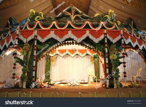 A stage traditional decorated for a hindu wedding. Venue Ceiling, Cheap Wedding Bouquets, Engagement Stage, Hindu Wedding Decorations, Navy Wedding Flowers, Stage Ideas, Wedding Hall Decorations, Red Wedding Flowers, Boho Wedding Flowers