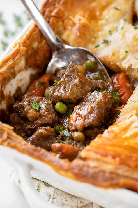 This beef pot pie features a hearty, slow-simmered beef stew filling topped with a flaky puff pastry crust, making for an extra cozy meal! | thecozyapron.com #beefpotpie #beefpotpierecipe #beefpotpierecipeeasy #beefpotpiewithpuffpastry #beefpotpiefilling Roast Pot Pie, Personal Pot Pies, Easy Beef Pot Pie, Pot Pie Variations, Puff Pastry Ground Beef Recipes, Beef Pie, Crockpot Beef Pot Pie, Beef Pot Pie With Puff Pastry, Beef Stew With Puff Pastry