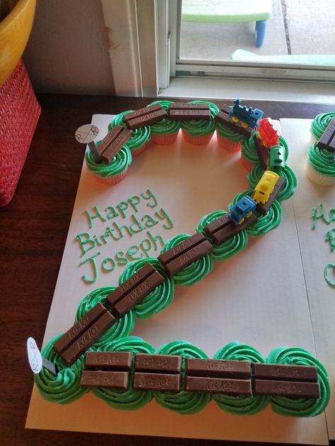 #2 train cupcake cake boy birthday Train Second Birthday Cake, Cupcake Train Cake, Easy Train Cake, Train Party Cake, Train Cupcakes For Boys, Train Cakes For Boys 2nd Birthday, Train Cupcake Cake, Train Cakes For Boys, Train Cake Ideas