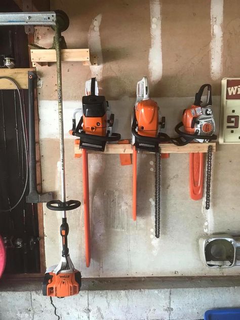 Chainsaw Holder For Garage, Tool Hanging Ideas, Chainsaw Organization, Chain Saw Storage, Chainsaw Storage Ideas, Chainsaw Storage, Shed Shelving, Garage Hacks, Garage Shelves