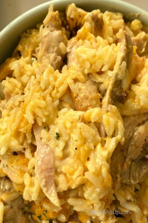 This Cheesy Chicken and Rice is fabulous. With chicken, white rice, cream of chicken soup, cheddar cheese and a few spices. Everything mixed in a baking dish and thrown in the oven. It is great for a weeknight dinner or a pot luck event. Cheesy Chicken And Rice Soup Recipes, Cheesy Chicken And Yellow Rice, Chicken And Rice Cream Of Chicken, Chicken Rice With Cream Of Chicken Soup, Chicken And Long Grain Rice Recipes, Cheesy Chicken And Rice Oven, Chicken Cheese And Rice Recipes, Cheesy Chicken And Rice Stovetop, Chicken And Cheddar Cheese Soup Recipes