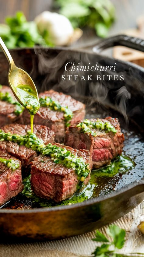 Sizzling steak bites in cast-iron skillet with drizzled chimichurri sauce, herbs and garlic, aptly captioned "Chimichurri Steak Bites". Chimichurri Ribeye Steak, Chimichurri Steak Bites, Recipes Using Chimichurri Sauce, Chimichurri Sauce Steak, Steak Wedding Dinner, Chimmichuri Recipes Easy, Ribeye Steak Bites, Pesto Steak, Finger Steaks