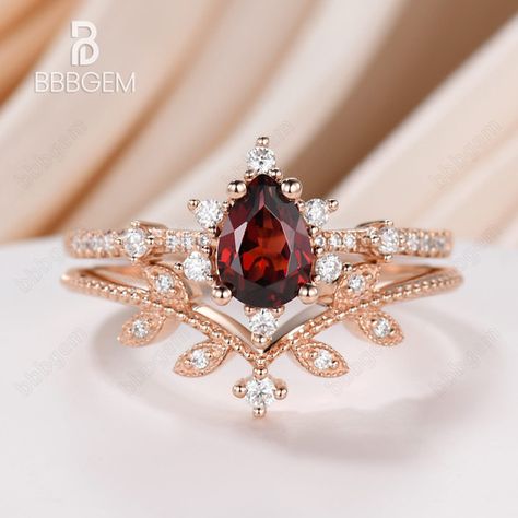 Luxury Red Ring Jewelry, Luxury Ruby Wedding And Engagement Ring With Accent Stones, Luxury Red Crystal Engagement Ring, Luxury Elegant Garnet Ring, Luxury Romantic Ruby Ring, Luxury Red Wedding Rings, Luxury Fine Jewelry Red Rings, Luxury Gold Wedding And Engagement Sets For Valentine's Day, Luxury Wedding Ruby Ring With Intricate Design